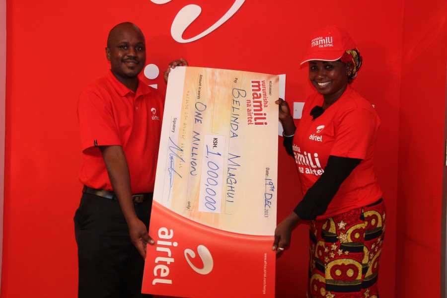 Belinda Mkacharo receives her dummy cheque