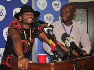 Award-winning vocalist Diamond Platnumz (left) shares his excitement for Tigo Music; the country's first mobile app that provides Tanzanians with unlimited access to music. To his left, Tigo Brand Manager, William Mpinga, during the press launch yesterday in Dar es Salaam.