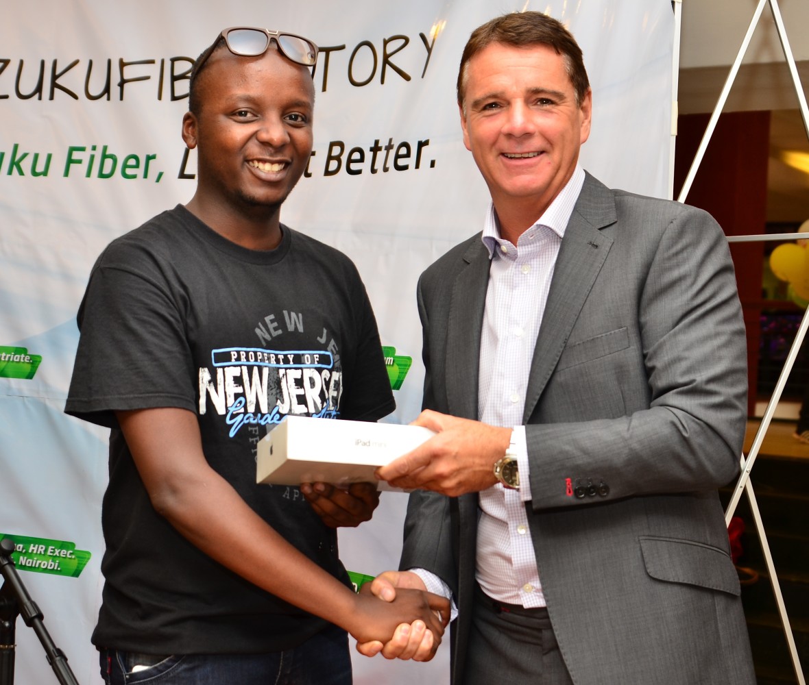 L-R, Kevin Oyugi, winner -(ipad), Richard Alden (CEO, Wananchi Group) 2