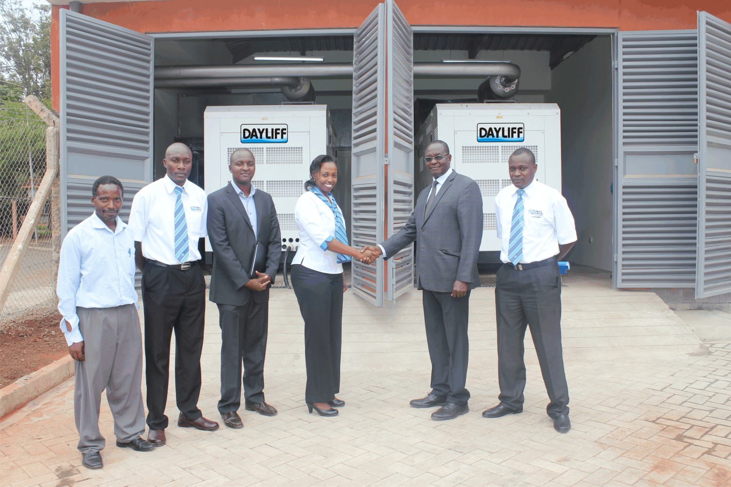 Right to left: Martin Gwada (Power Product Manager, Davis and Shirtliff's ), Albert Waweru, (Chairman of Ruaraka Housing Estate Limited) Margaret Kuchio (General Manager Sales, Davis and Shirtliff), Julius Riungu (Engineer, MAK Consulting Ltd) and Simon Shikuku (Lead Project Engineer, Davis and Shirtliff) during the commissioning of the two 250kVA Dayliff Yanan synchronised standby generators for Safari Business Arcade